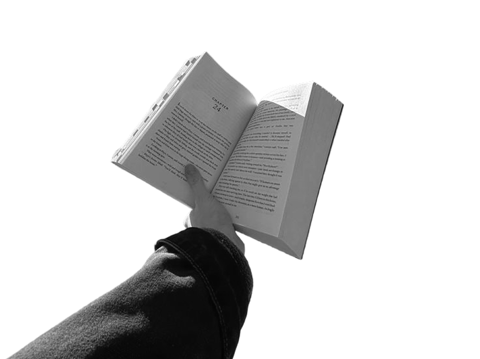 Hand holding open book